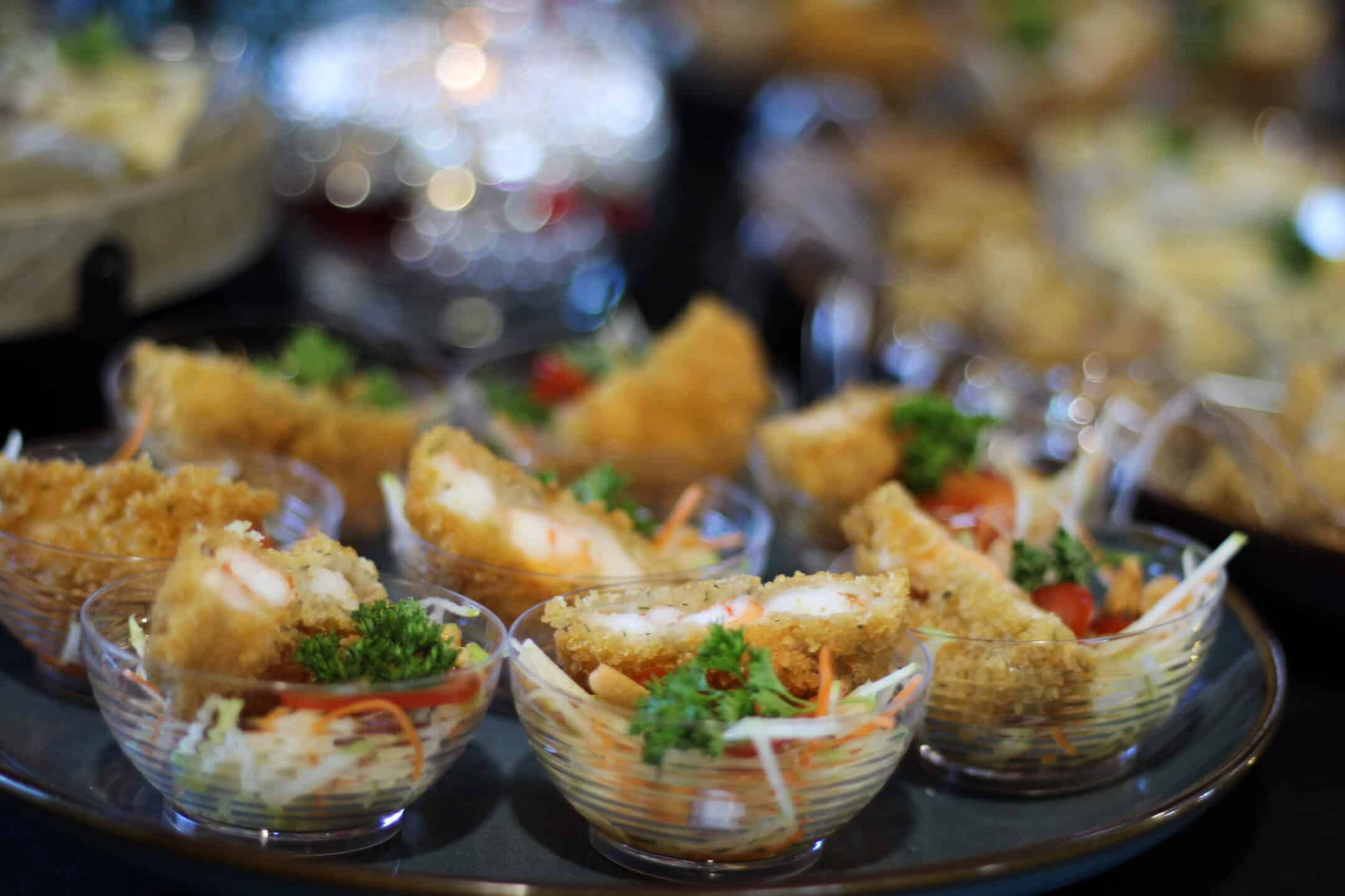 Cups of sample food from Blue Oyster restaurant featured at bridal showcase